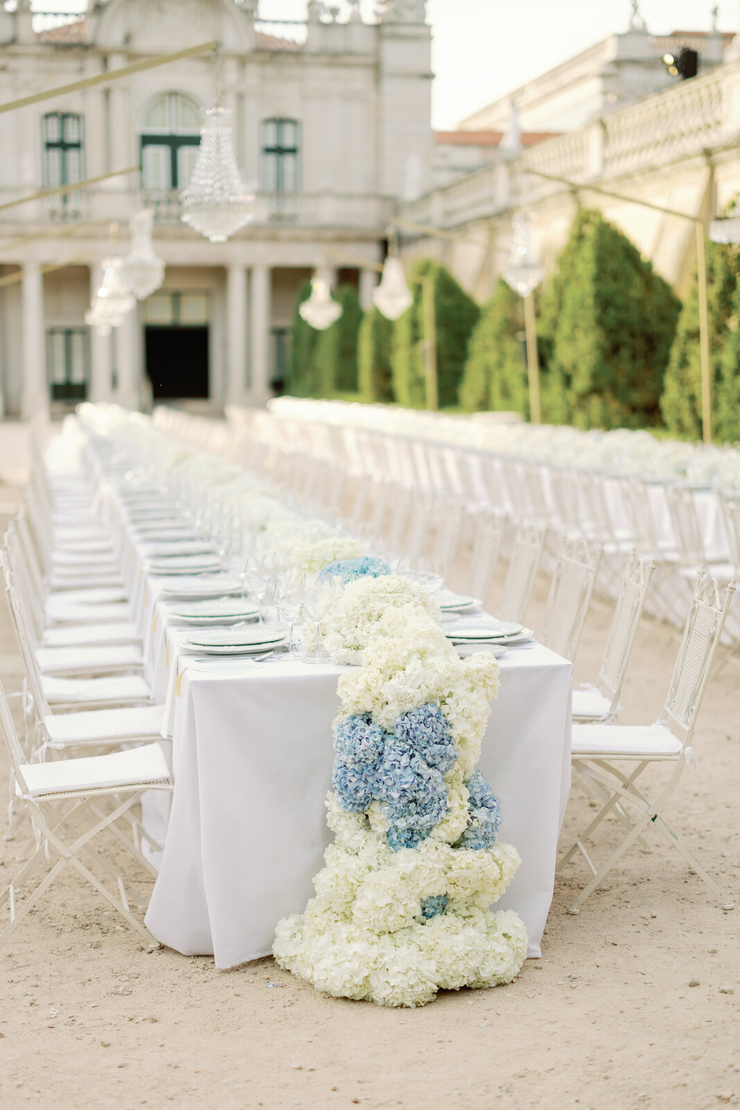 White and blue hydrangea floral runner cascading down a table